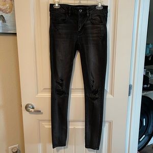 American Eagle Outfitters, black jeans with holes.